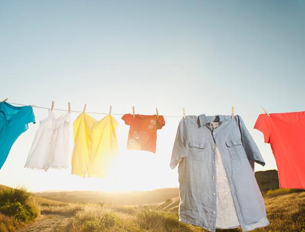 Why are clothes dried in the dryer soft and in the sun hard and rough?