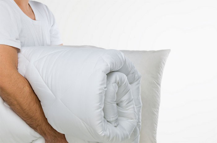 Should I wash my comforter in the washing machine?